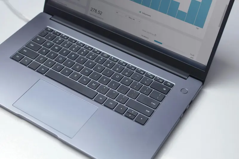 Flexible Escrow Solutions laptop screen displaying source code